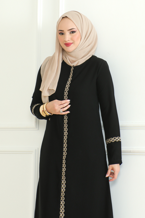 Side view of black lace-trim abaya showing woven trim along the centre front