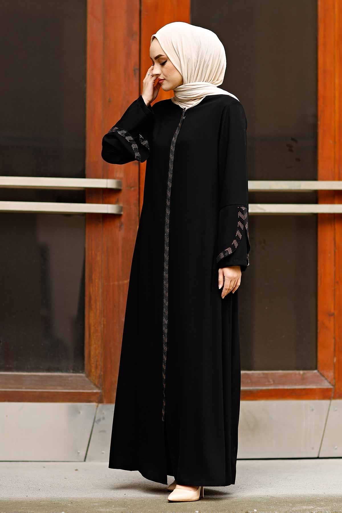 Side view of black open-front abaya showing bell sleeve drape and rhinestone cuff trim