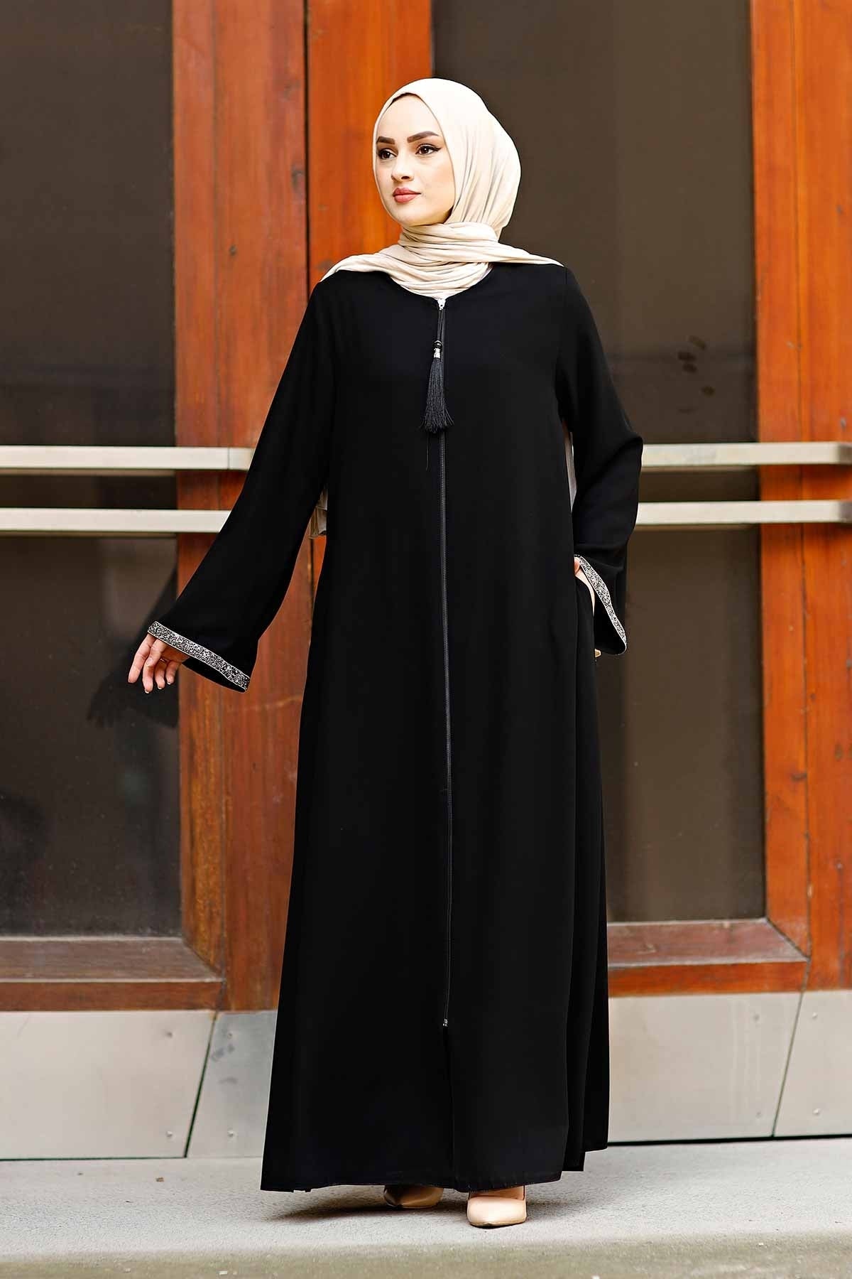 Full-length black stone-trim abaya showing A-line drape and floor-length hem
