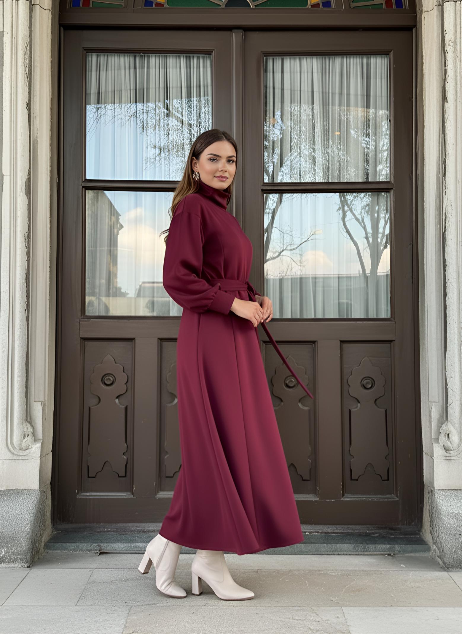 Red winter maxi dress showing high turtleneck neckline and self-tie waist belt