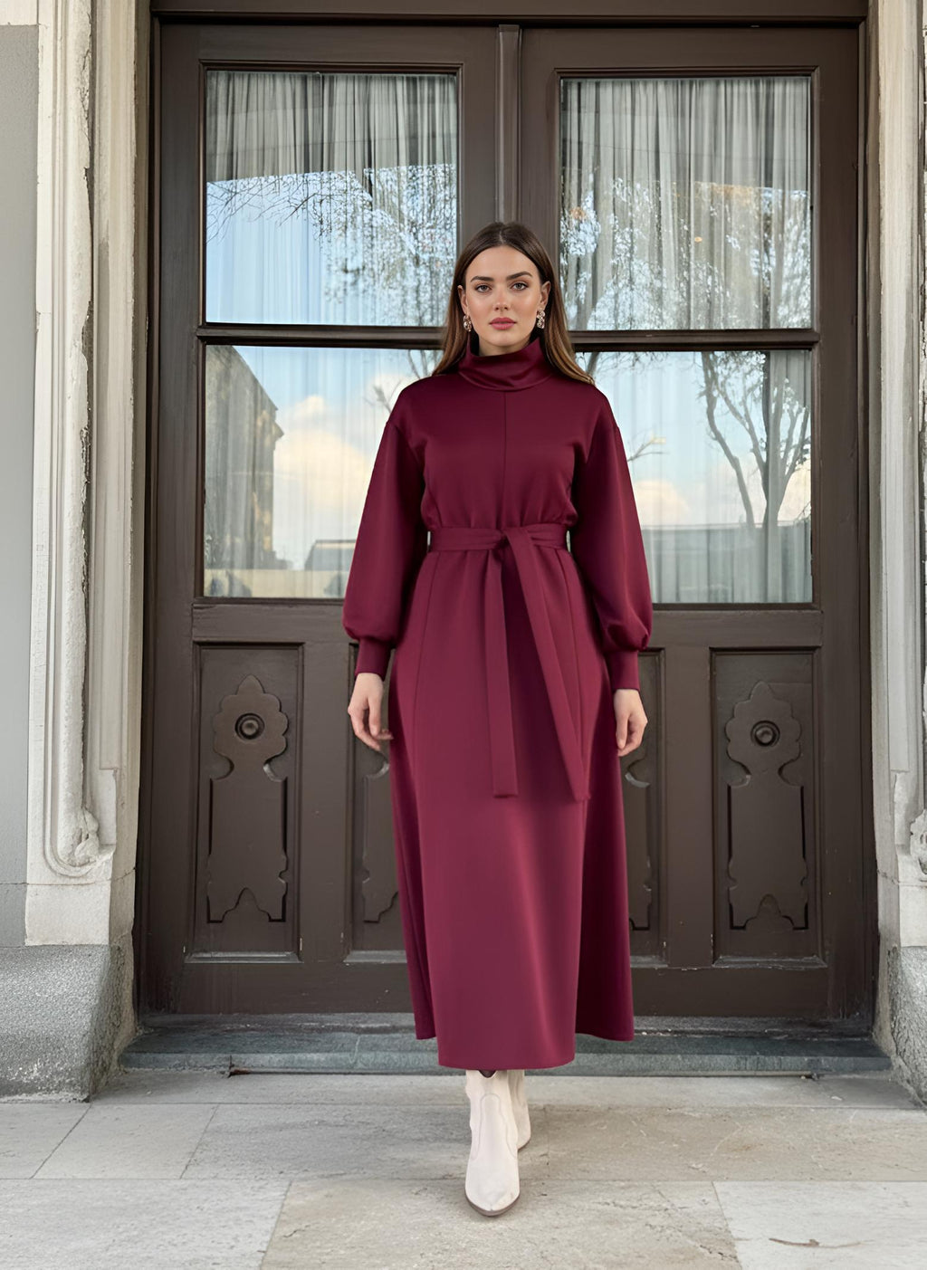 Close detail of red modest dress sleeve with elasticated cuff