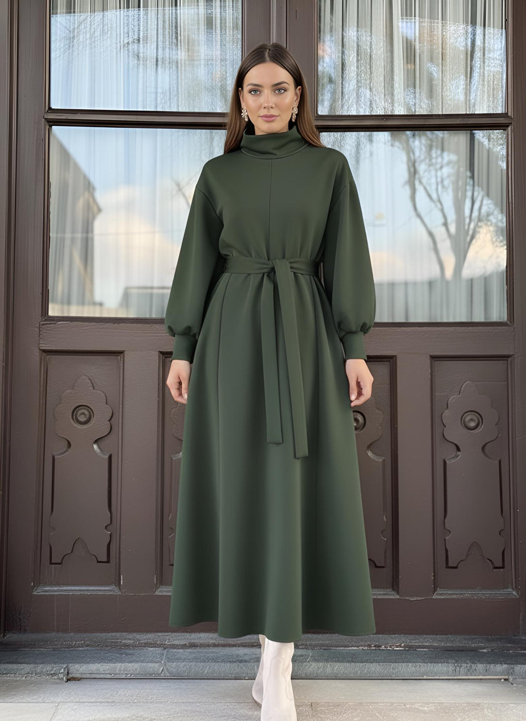 Close detail of green modest dress sleeve with elasticated cuff