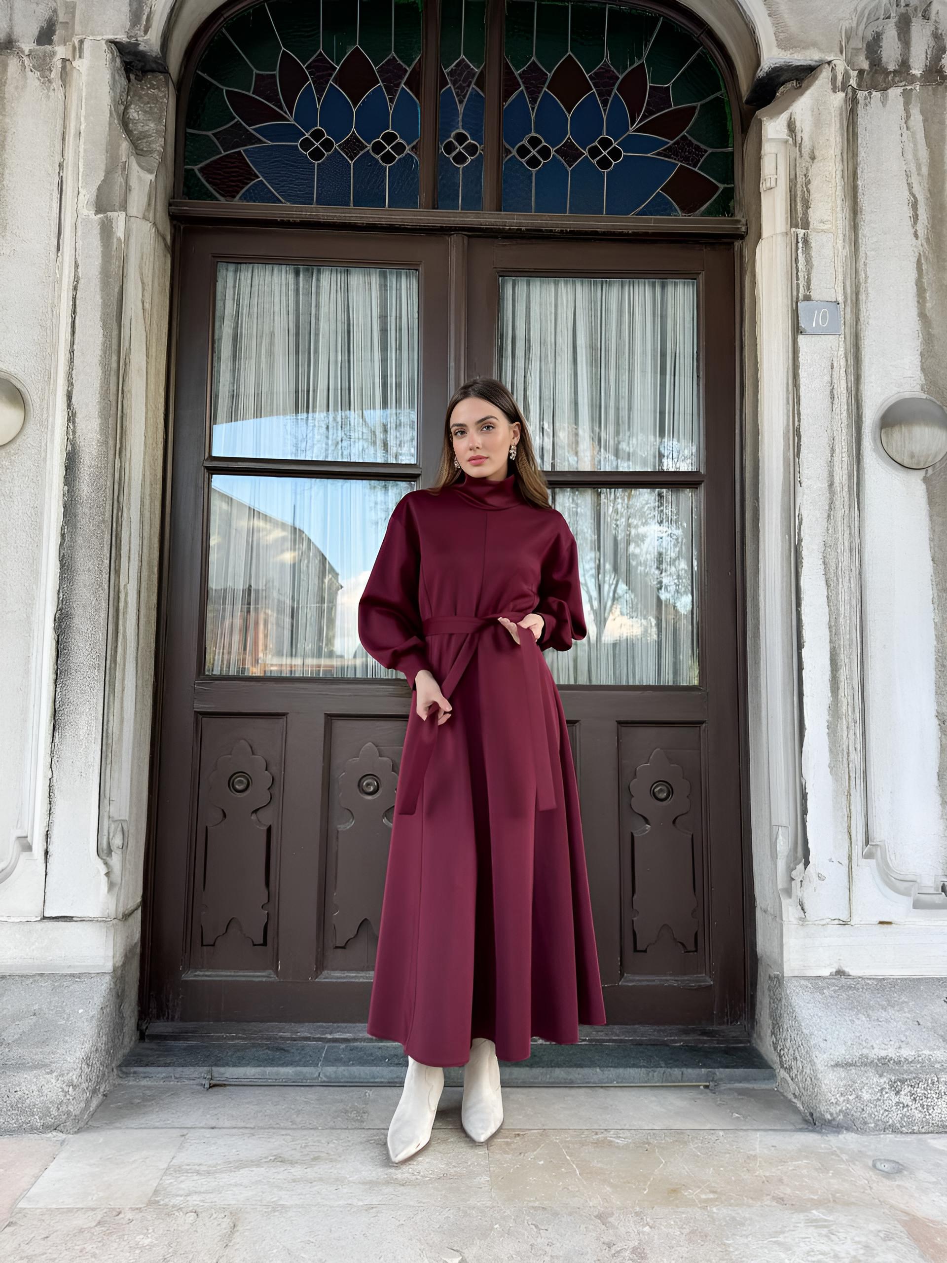 Red belted turtleneck dress styled for winter modest wear