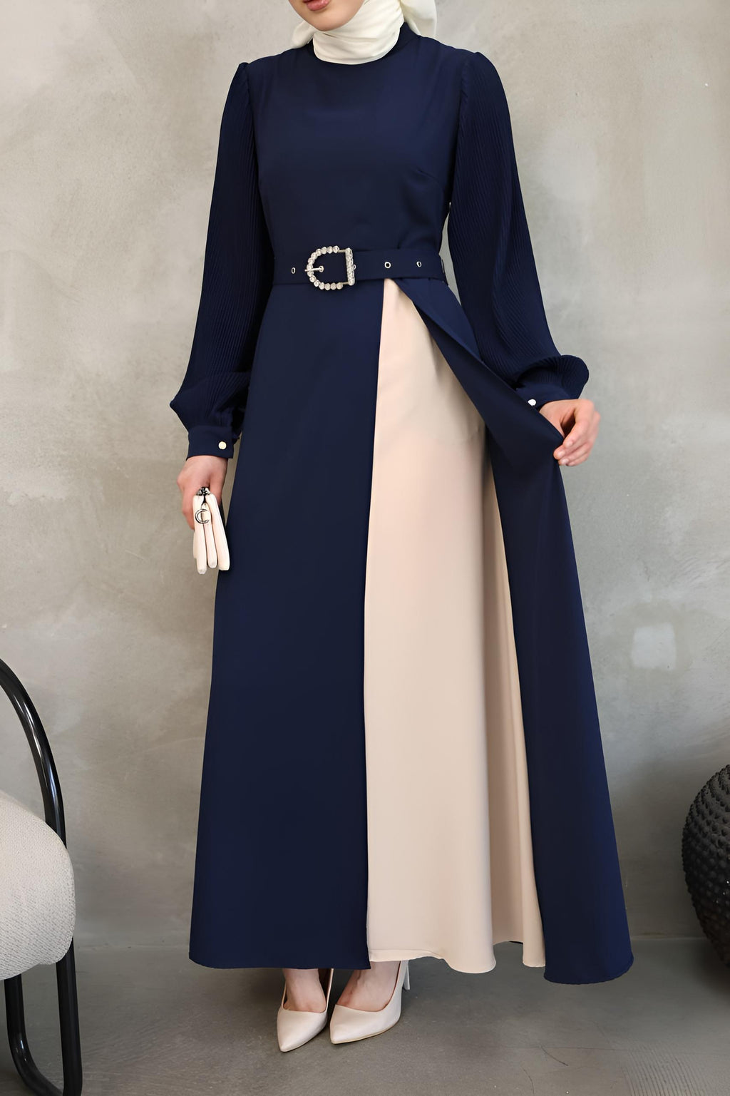 Side view of navy asymmetrical maxi dress showing open-front overlay drape