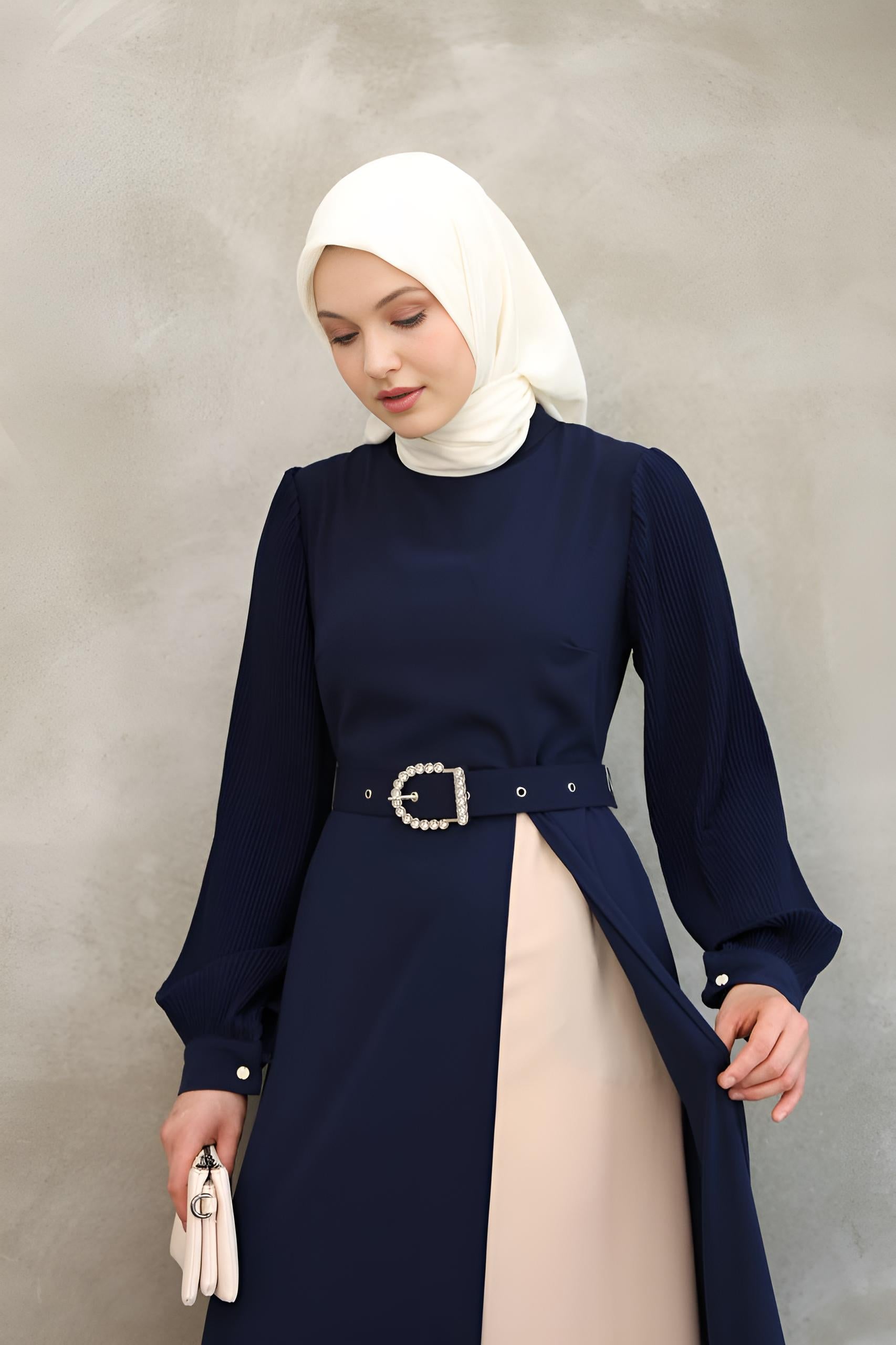 Full-length navy asymmetrical maxi dress with mock neck and contrast inner skirt