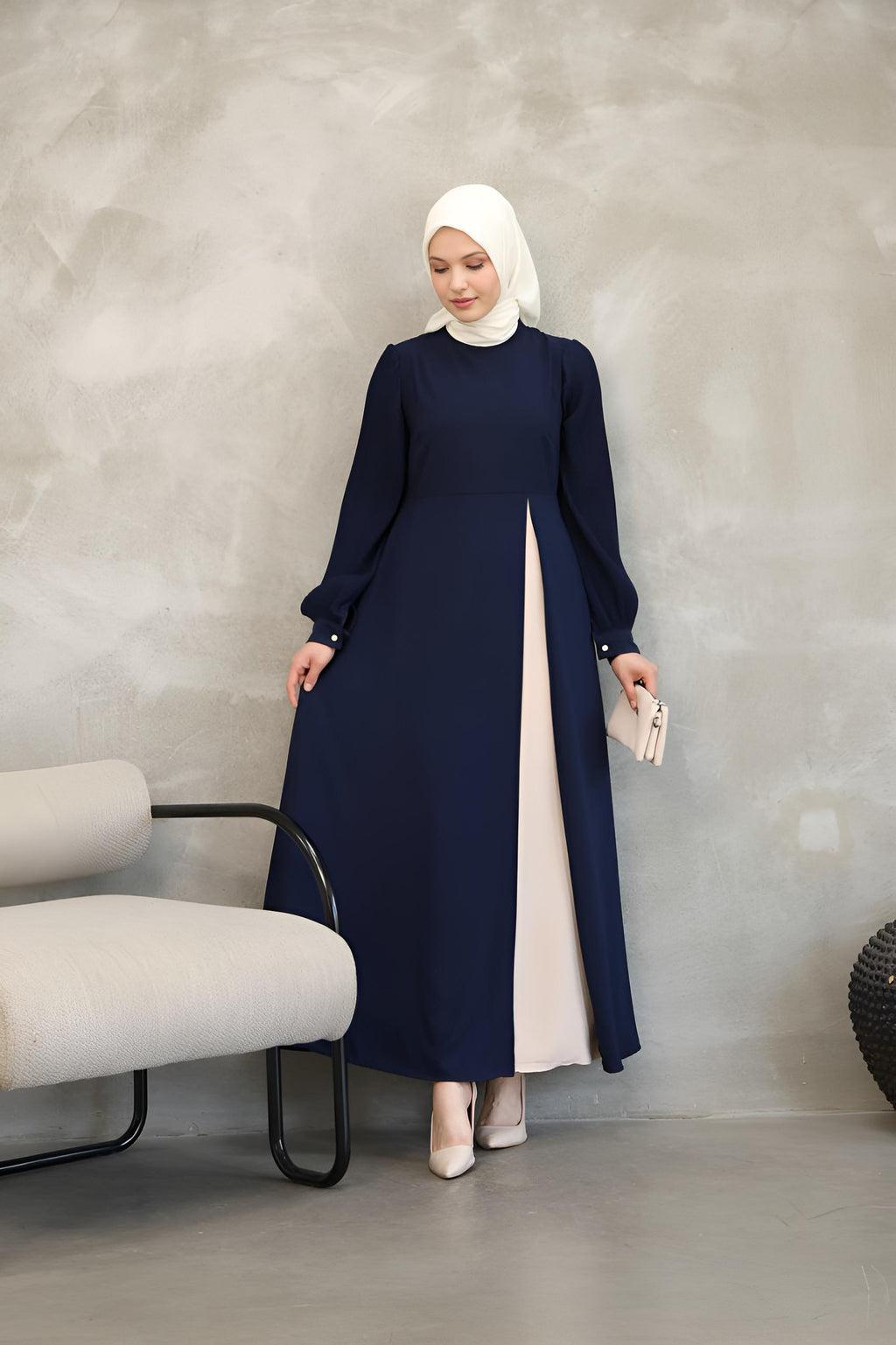 Navy asymmetrical belted maxi dress styled for evening and formal occasions