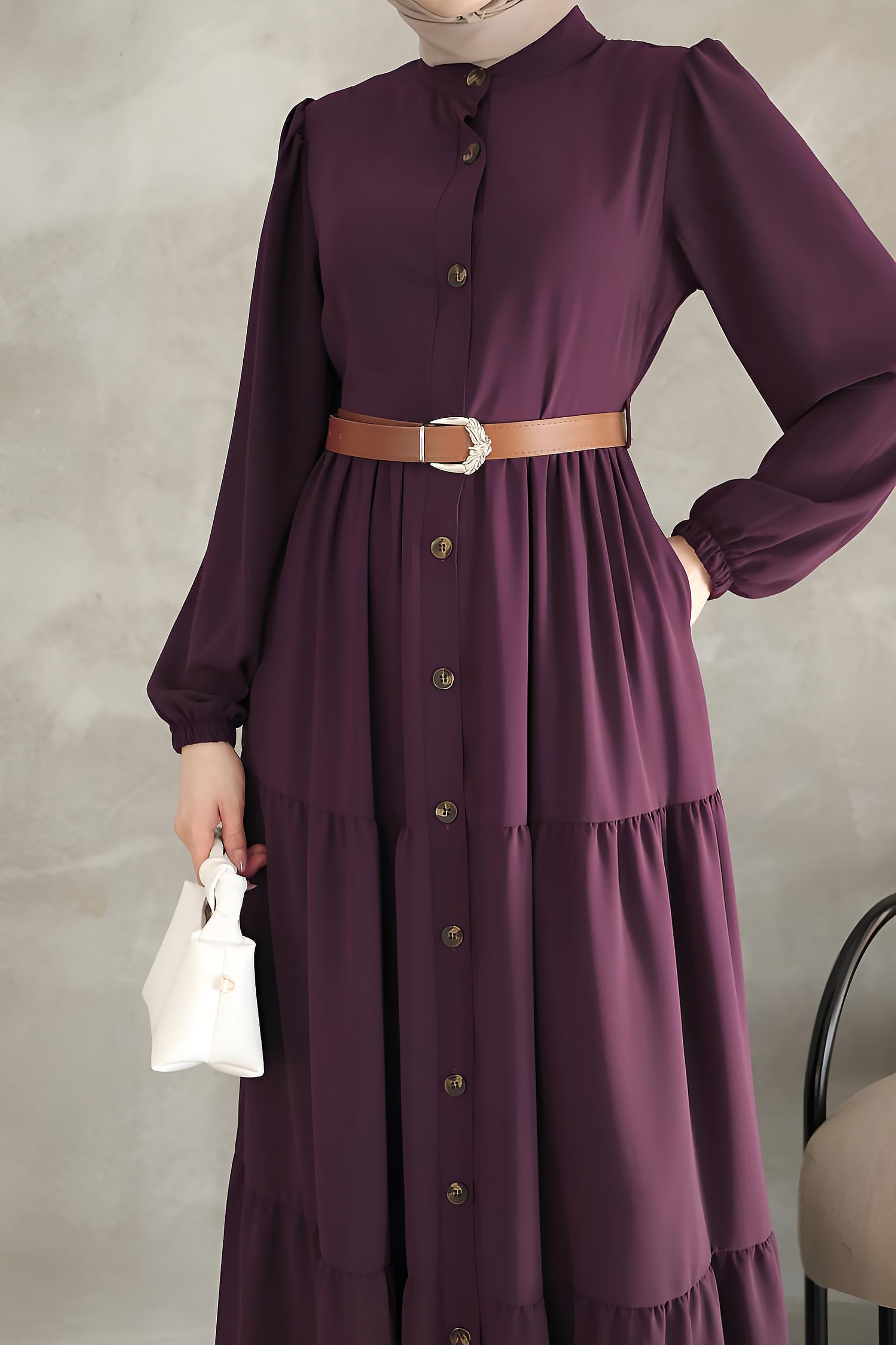 Close-up of purple maxi dress mandarin collar and decorative button placket