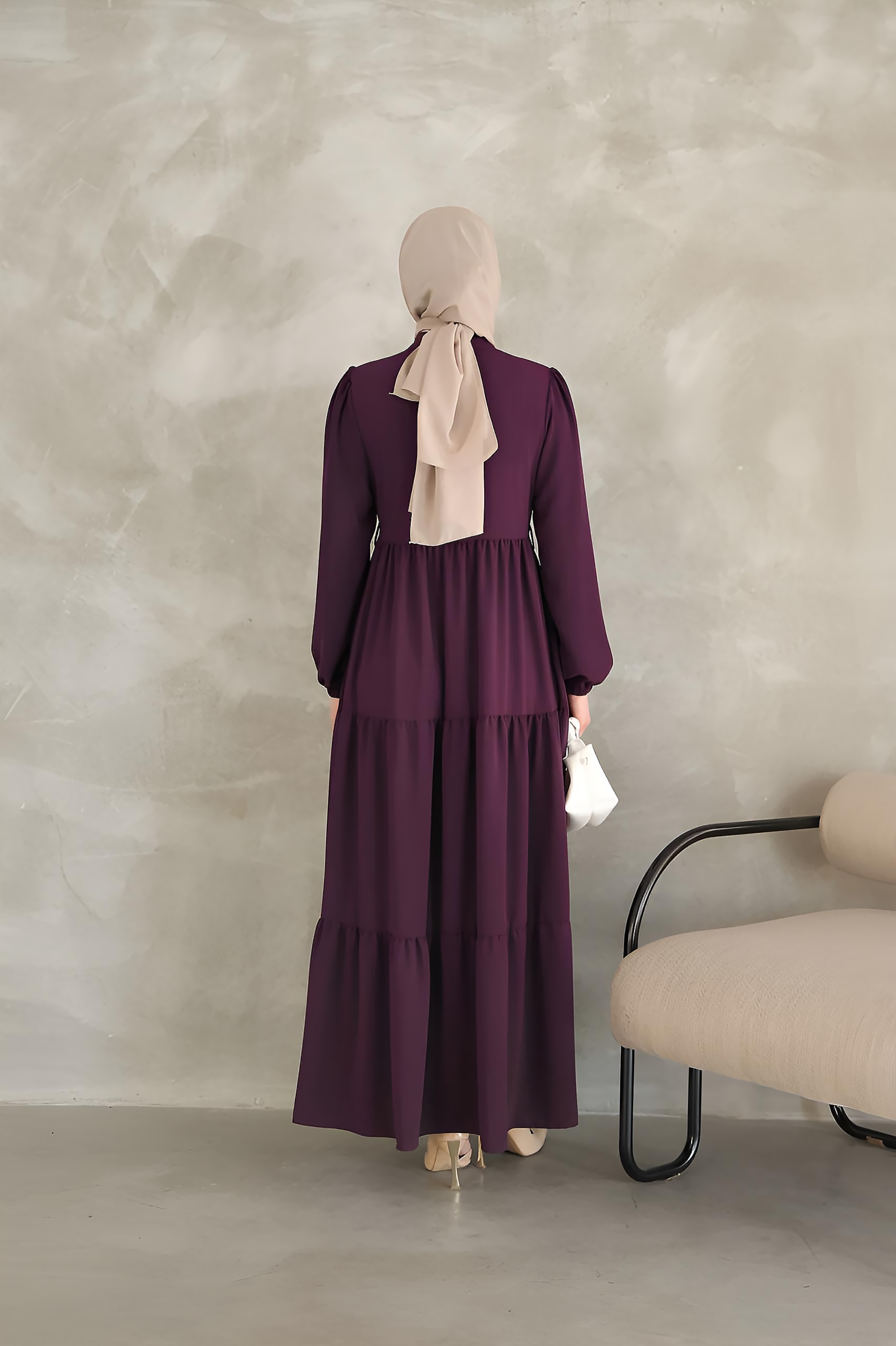 Detail of balloon sleeve with elasticated cuff on a purple tiered maxi dress