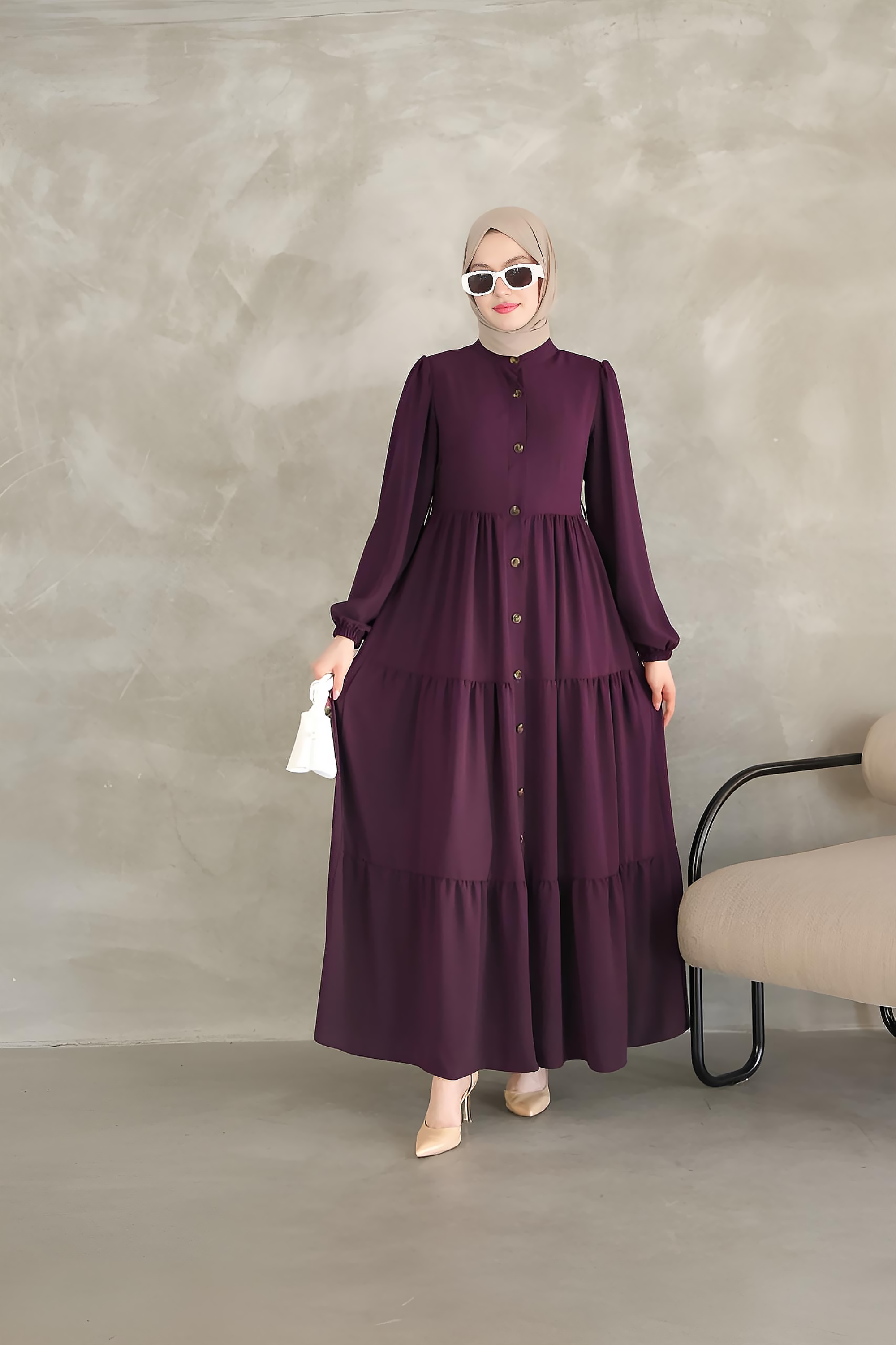 Purple tiered maxi dress showing tan leather-look belt fastened at the waist