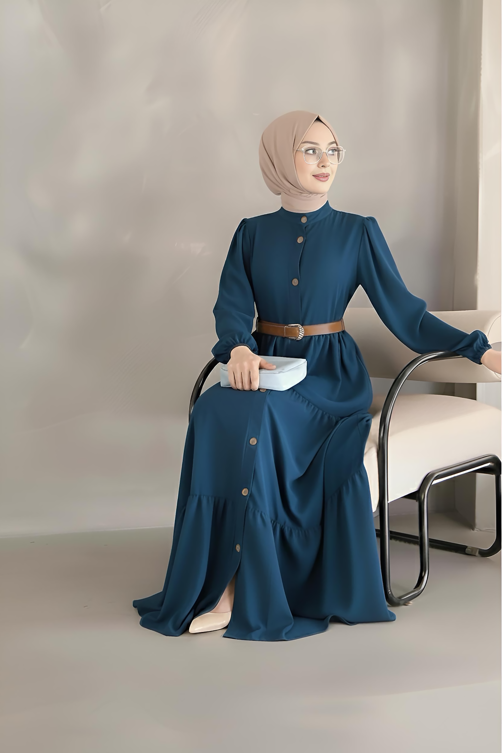 Navy tiered maxi dress showing tan leather-look belt fastened at the waist