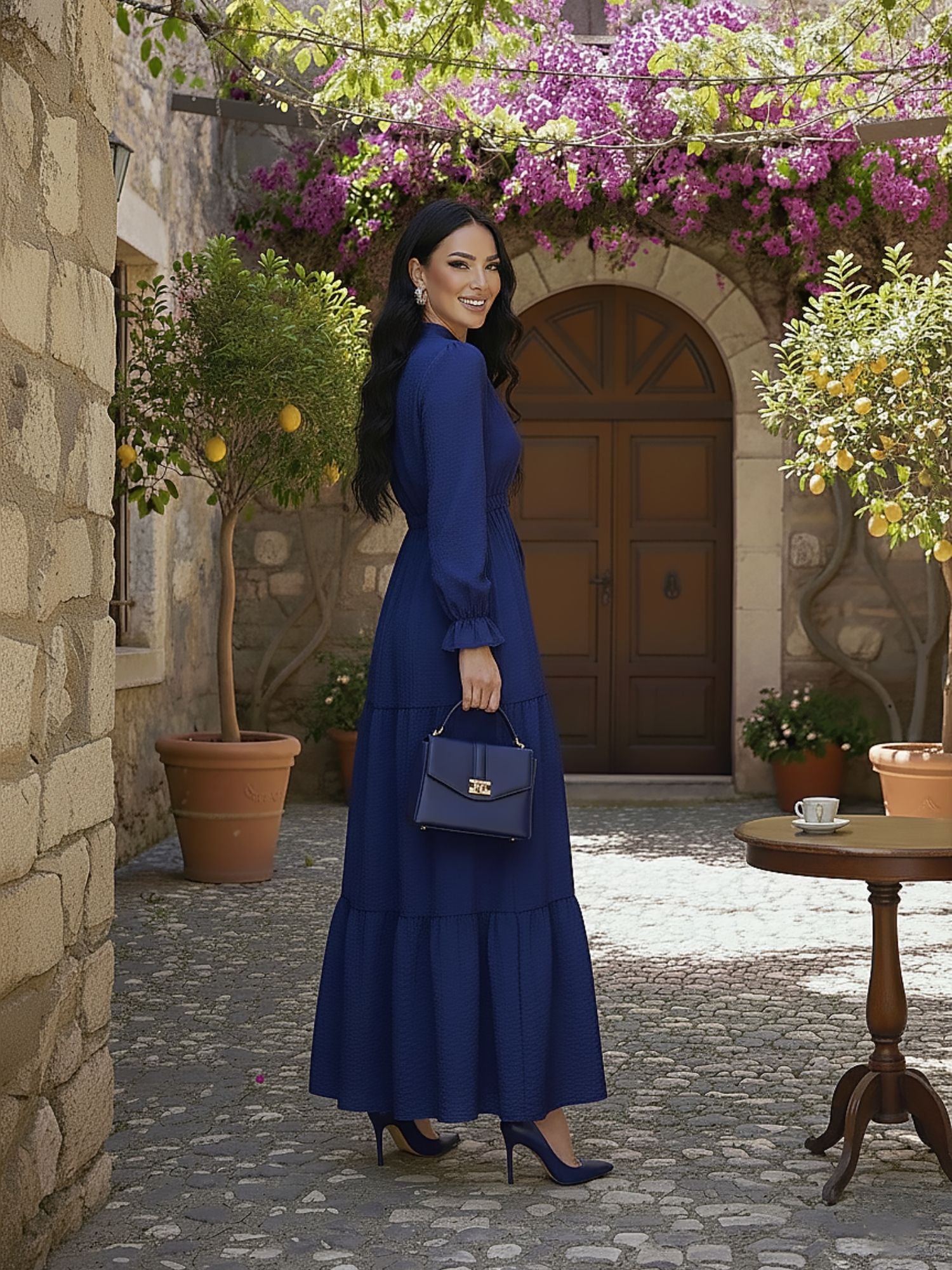 Side view of navy tiered modest maxi dress showing flowing tiered skirt