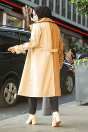 a woman in a dress is walking down the street